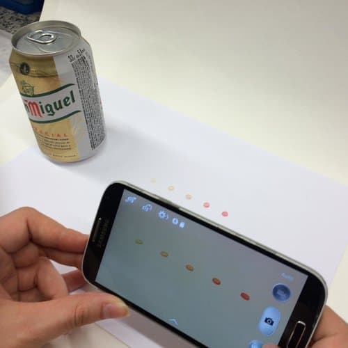 Smartphone_capturing_sensor_disc_soaked_with_beer