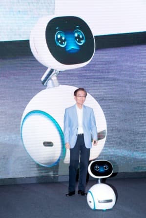 ASUS Chairman Jonney Shih interacts on stage with ASUS Zenbo